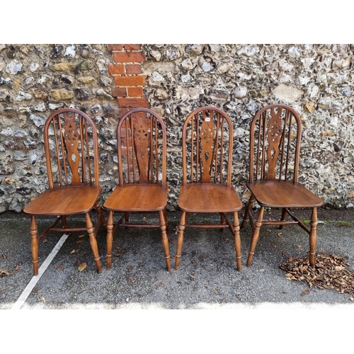 1772 - A set of four Old Charm elm and beech wheelback chairs. 