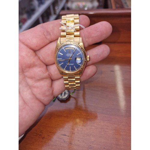 233 - A circa 1975 Rolex 'President' Oyster Perpetual Day-Date 18ct gold wristwatch, blue dial,  36mm, Ref... 