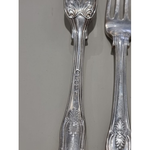 80A - A part canteen of George IV king's pattern cutlery, comprising; eleven table forks, ten dessert fork... 