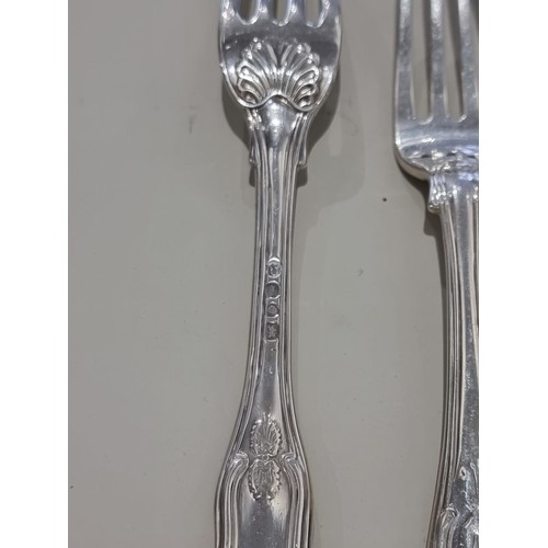 80A - A part canteen of George IV king's pattern cutlery, comprising; eleven table forks, ten dessert fork... 