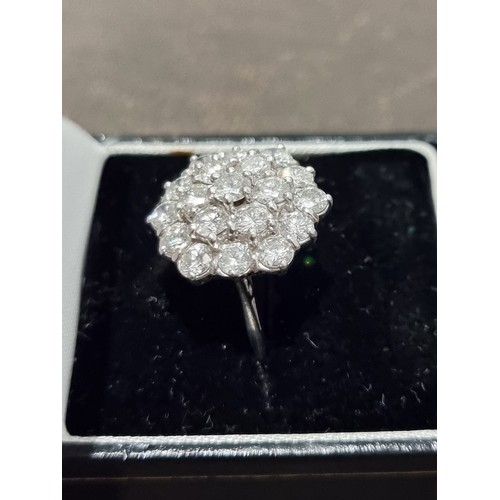 170A - A diamond cluster ring, stamped 18ct, set 19 brilliant cut diamonds totalling approximately 2.8ct, s... 