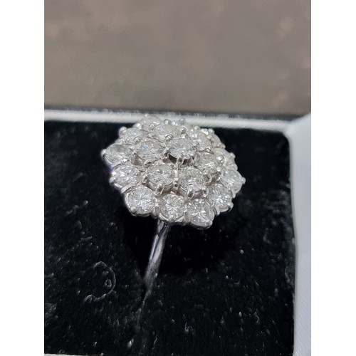 170A - A diamond cluster ring, stamped 18ct, set 19 brilliant cut diamonds totalling approximately 2.8ct, s... 