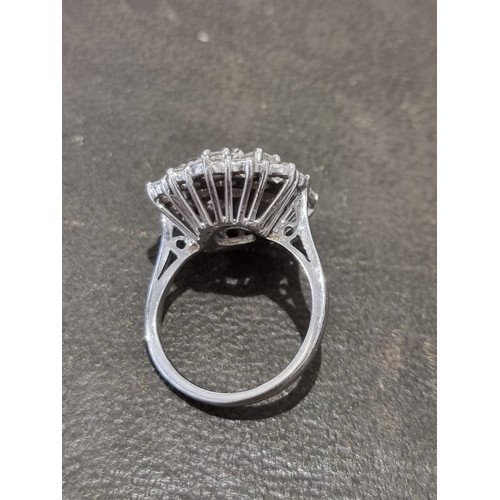 170A - A diamond cluster ring, stamped 18ct, set 19 brilliant cut diamonds totalling approximately 2.8ct, s... 