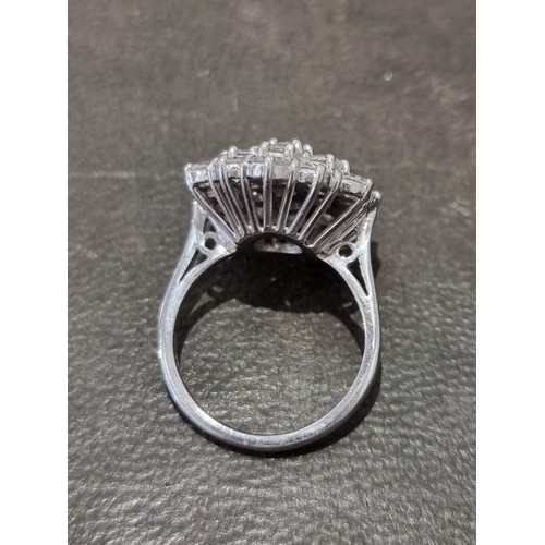 170A - A diamond cluster ring, stamped 18ct, set 19 brilliant cut diamonds totalling approximately 2.8ct, s... 