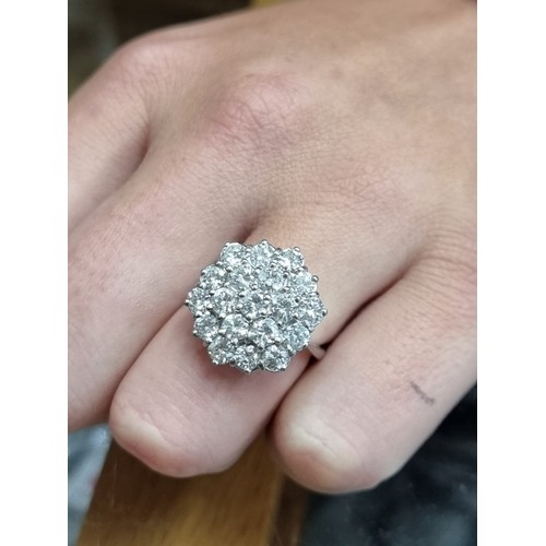 170A - A diamond cluster ring, stamped 18ct, set 19 brilliant cut diamonds totalling approximately 2.8ct, s... 