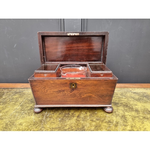 1028 - A Regency rosewood sarcophagus tea caddy, 31.5cm wide.