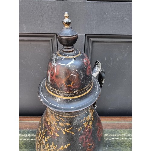 1151 - An early 19th century Pontypool toleware tea urn and cover, 51cm high.