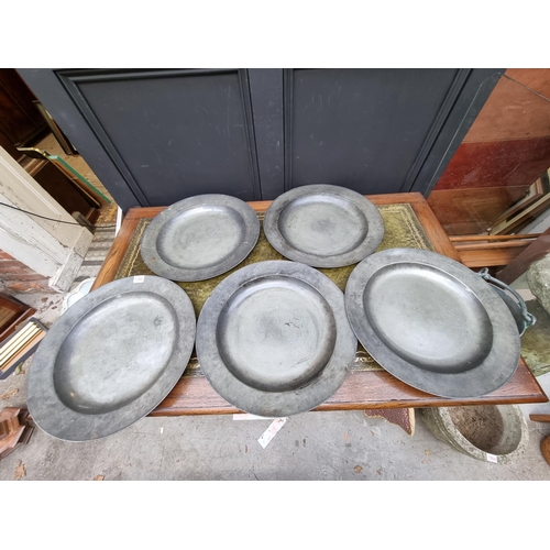 1197 - A set of five antique pewter chargers, 42cm diameter. (5)