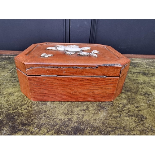 1347 - A Japanese elm and bone casket, of canted rectangular form, 23cm wide.