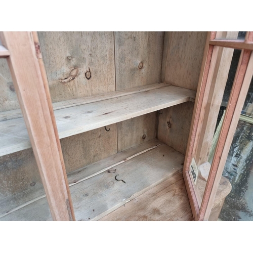 1000 - An antique pine bookcase, 131.5cm wide. 