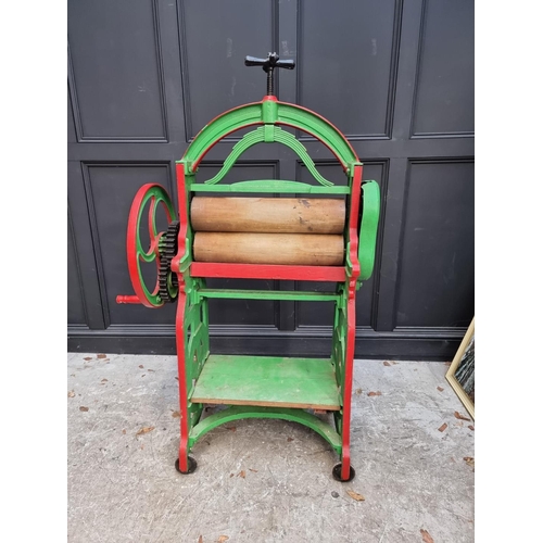 1002 - A Victorian green and red painted mangle, by 'H J & E A Boolds Ltd, Devonport', 154cm high. ... 