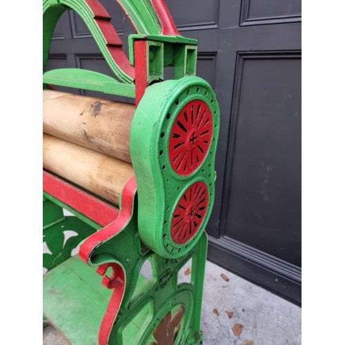 1002 - A Victorian green and red painted mangle, by 'H J & E A Boolds Ltd, Devonport', 154cm high. ... 