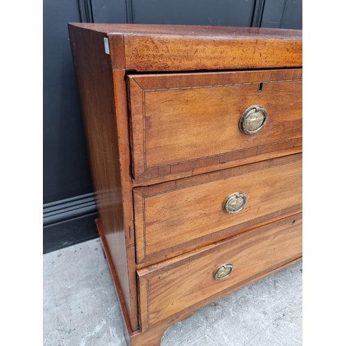 1005 - A George III mahogany and crossbanded chest, of two short and two long drawers, 91cm wide.... 