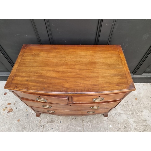 1006 - An early 19th century mahogany bowfront chest, of two short and two long drawers, 91cm wide.... 