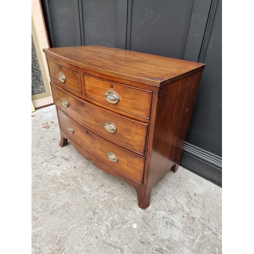 1006 - An early 19th century mahogany bowfront chest, of two short and two long drawers, 91cm wide.... 