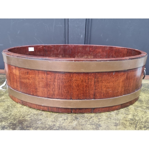 1008 - A 19th century mahogany and brass bound shallow wine cooler or jardiniere, 57.5cm wide.   ... 