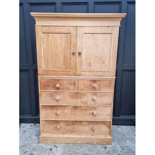 1015 - An antique pine chest of drawers, with detachable cupboard superstructure, 130cm wide. ... 