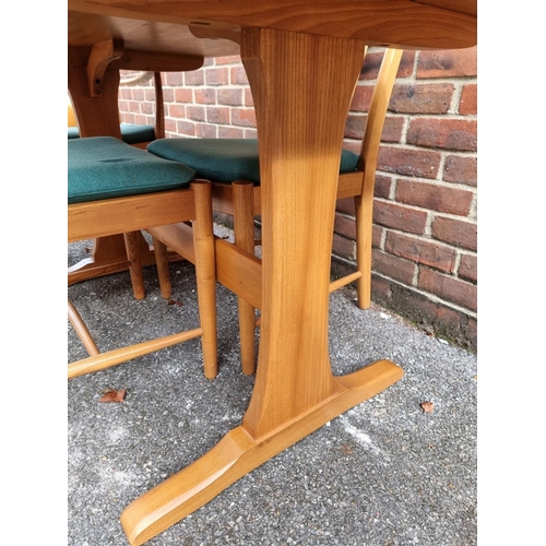 1018 - An Ercol elm dining table and four chairs, to include a pair of elbow chairs, the table 152.5cm long... 