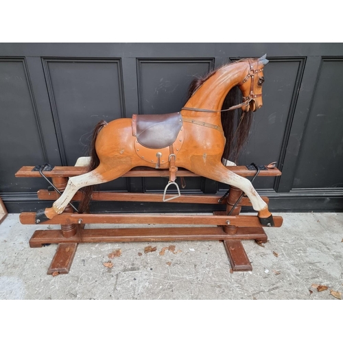 1024 - A large painted wood rocking horse, 165cm long. 