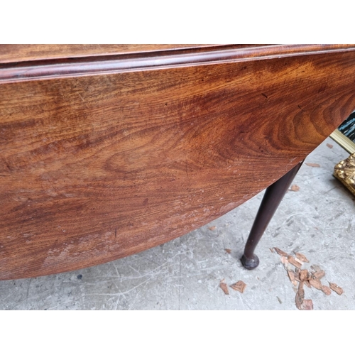 1034 - An 18th century mahogany gateleg table, of good colour, 106cm wide. 