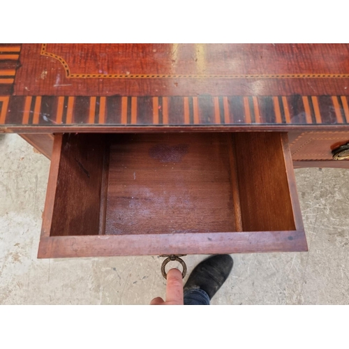 1040 - An Edwardian mahogany and inlaid bedroom suite, comprising: a triple wardrobe, 200.5cm wide; a mirro... 