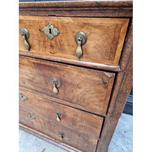 1042 - An 18th century oak and walnut chest of drawers, 93cm wide, (in two parts). ... 