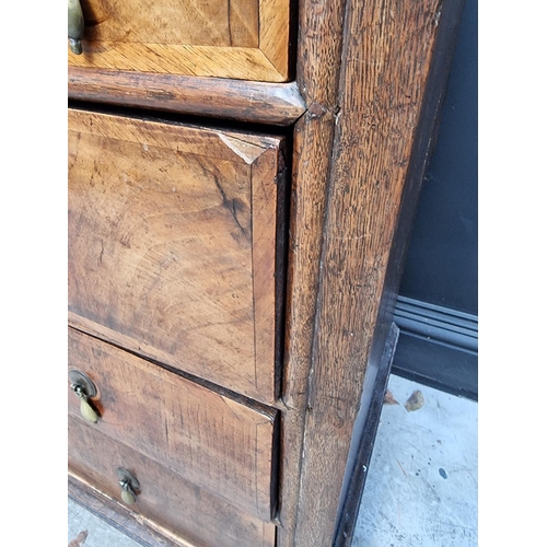 1042 - An 18th century oak and walnut chest of drawers, 93cm wide, (in two parts). ... 