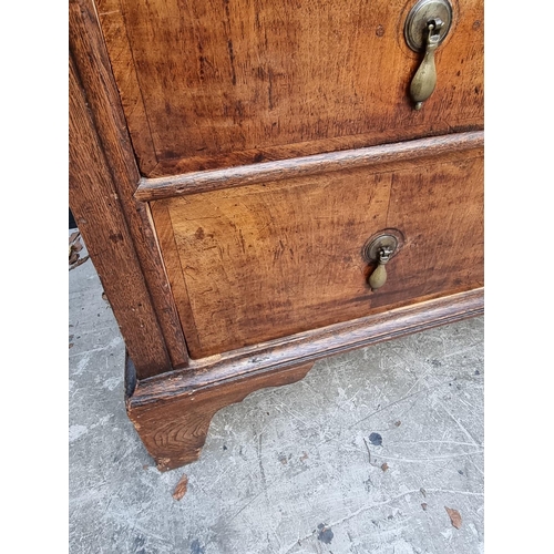 1042 - An 18th century oak and walnut chest of drawers, 93cm wide, (in two parts). ... 