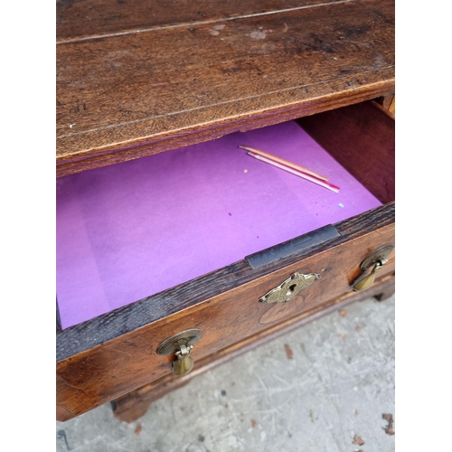 1042 - An 18th century oak and walnut chest of drawers, 93cm wide, (in two parts). ... 