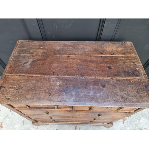 1042 - An 18th century oak and walnut chest of drawers, 93cm wide, (in two parts). ... 