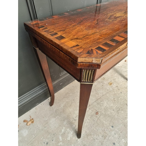 1047 - An early 19th century rosewood and coromandel card table, with double gateleg, 91.5cm wide. ... 