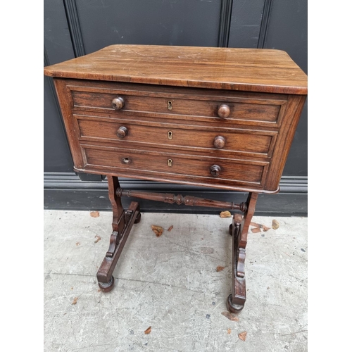 1052 - An early Victorian rosewood work table, 50cm wide.