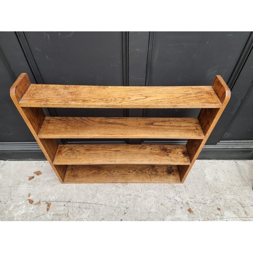 1054 - A small antique mahogany table top revolving bookcase, 34.5cm wide. 