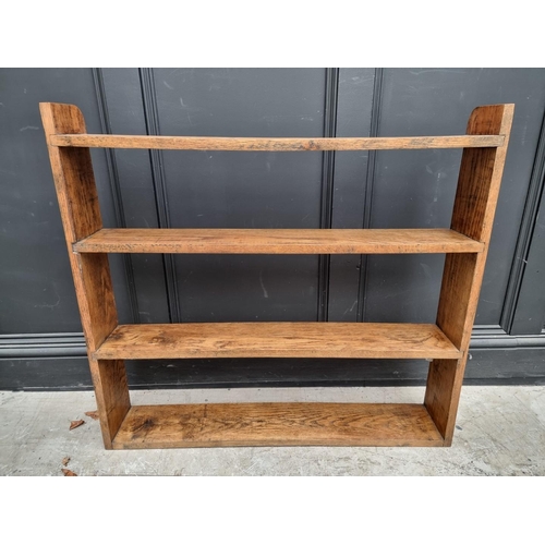 1054 - A small antique mahogany table top revolving bookcase, 34.5cm wide. 