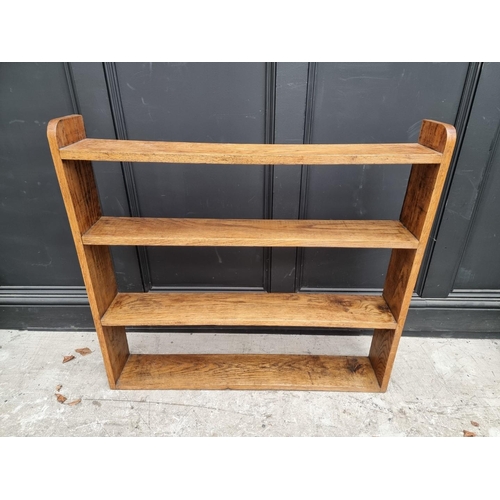 1054 - A small antique mahogany table top revolving bookcase, 34.5cm wide. 