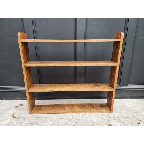 1054 - A small antique mahogany table top revolving bookcase, 34.5cm wide. 