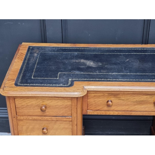 1060 - A late Victorian satin birch inverted breakfront pedestal desk, 121cm wide. ... 