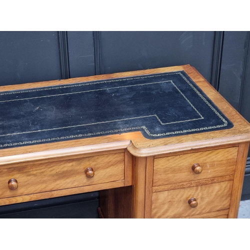 1060 - A late Victorian satin birch inverted breakfront pedestal desk, 121cm wide. ... 