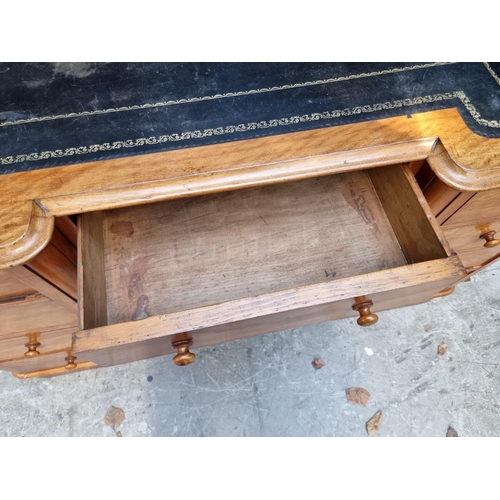 1060 - A late Victorian satin birch inverted breakfront pedestal desk, 121cm wide. ... 