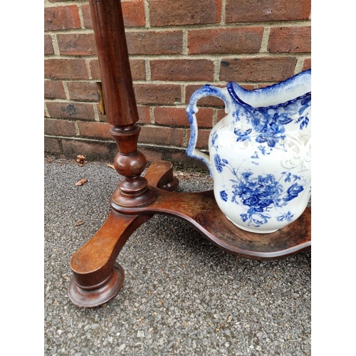 1061 - A Victorian mahogany washstand, with blue & white pottery jug and basin, 88cm wide.... 