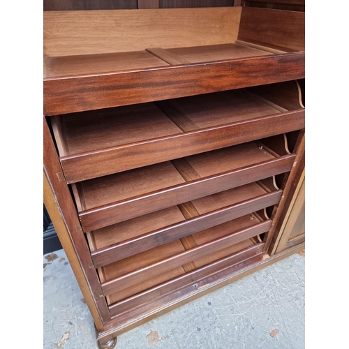 1069 - A small early 20th century mahogany triple wardrobe, 152.5cm wide. 