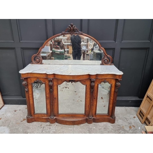 1071 - A Victorian walnut credenza, with mirror back and shaped marble top, 156cm wide.