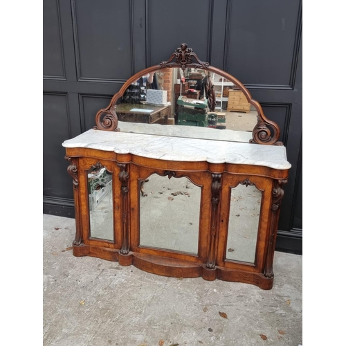 1071 - A Victorian walnut credenza, with mirror back and shaped marble top, 156cm wide.