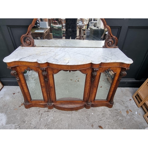 1071 - A Victorian walnut credenza, with mirror back and shaped marble top, 156cm wide.