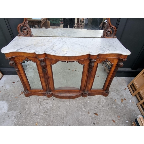 1071 - A Victorian walnut credenza, with mirror back and shaped marble top, 156cm wide.