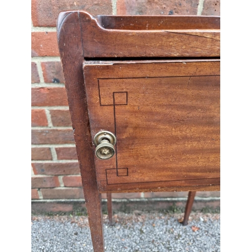 1074 - A Regency mahogany and line inlaid pot cupboard, 35cm wide.