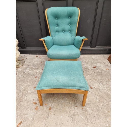 1083 - An Ercol 'Evergreen' armchair; together with an Ercol 'Saville' elm stool. 