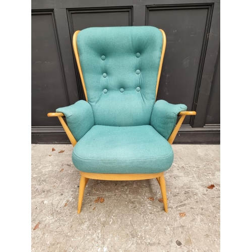 1083 - An Ercol 'Evergreen' armchair; together with an Ercol 'Saville' elm stool. 