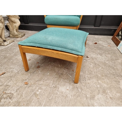 1083 - An Ercol 'Evergreen' armchair; together with an Ercol 'Saville' elm stool. 