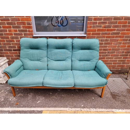 1084 - An Ercol 'Saville' elm three seater settee.  